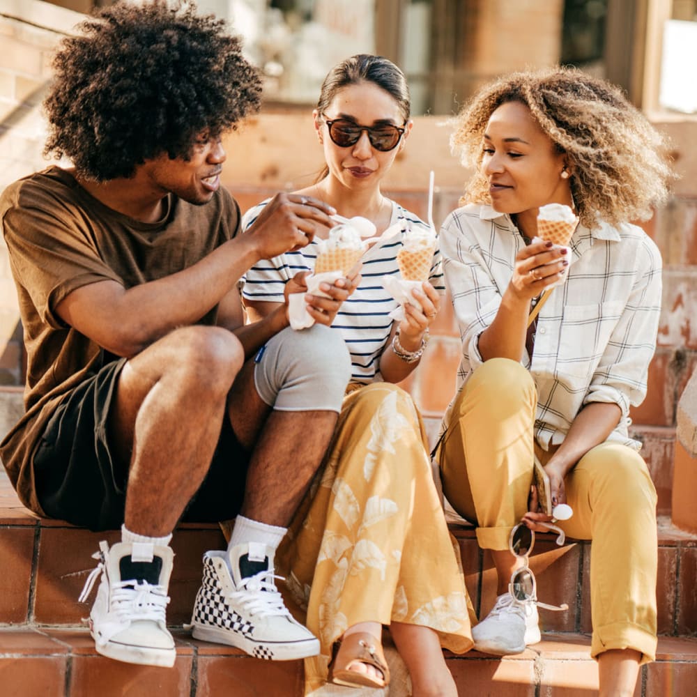 Residents taking a break from their walk downtown and enjoying some ice cream near Oaks White Rock in Dallas, Texas