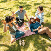 Resident friends out for a feast at their favorite restaurant near The Lofts At Clifford Brown Walk in Wilmington, Delaware