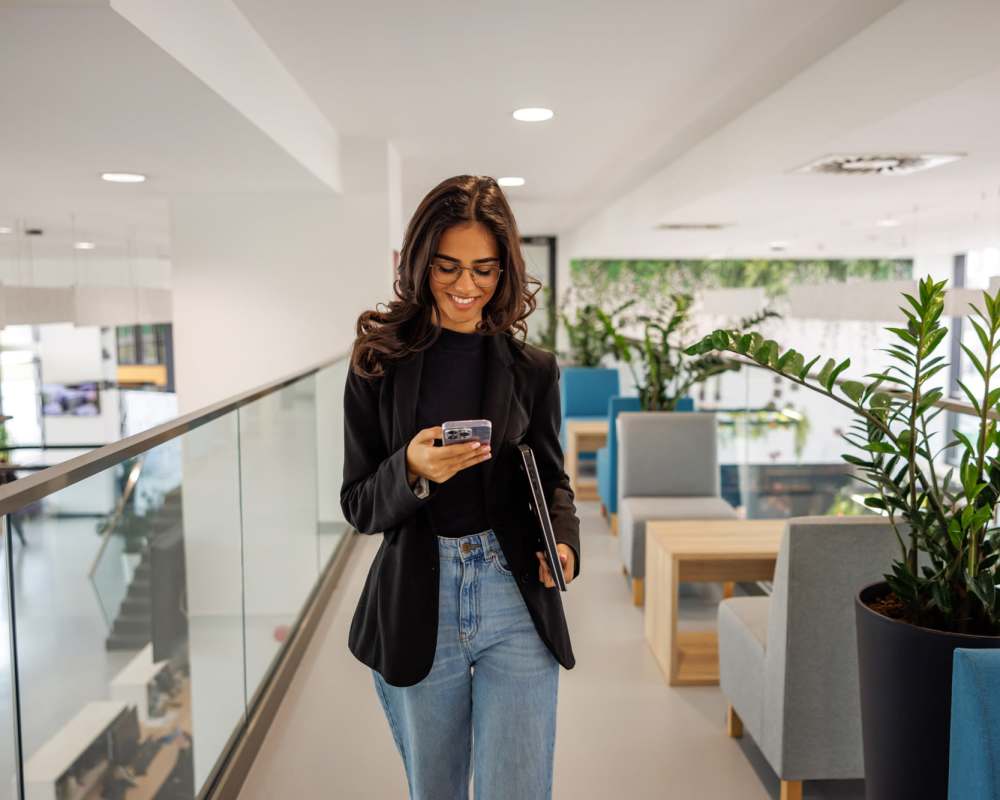 Team member looking at their phone at Stintino Management in Charlotte, North Carolina