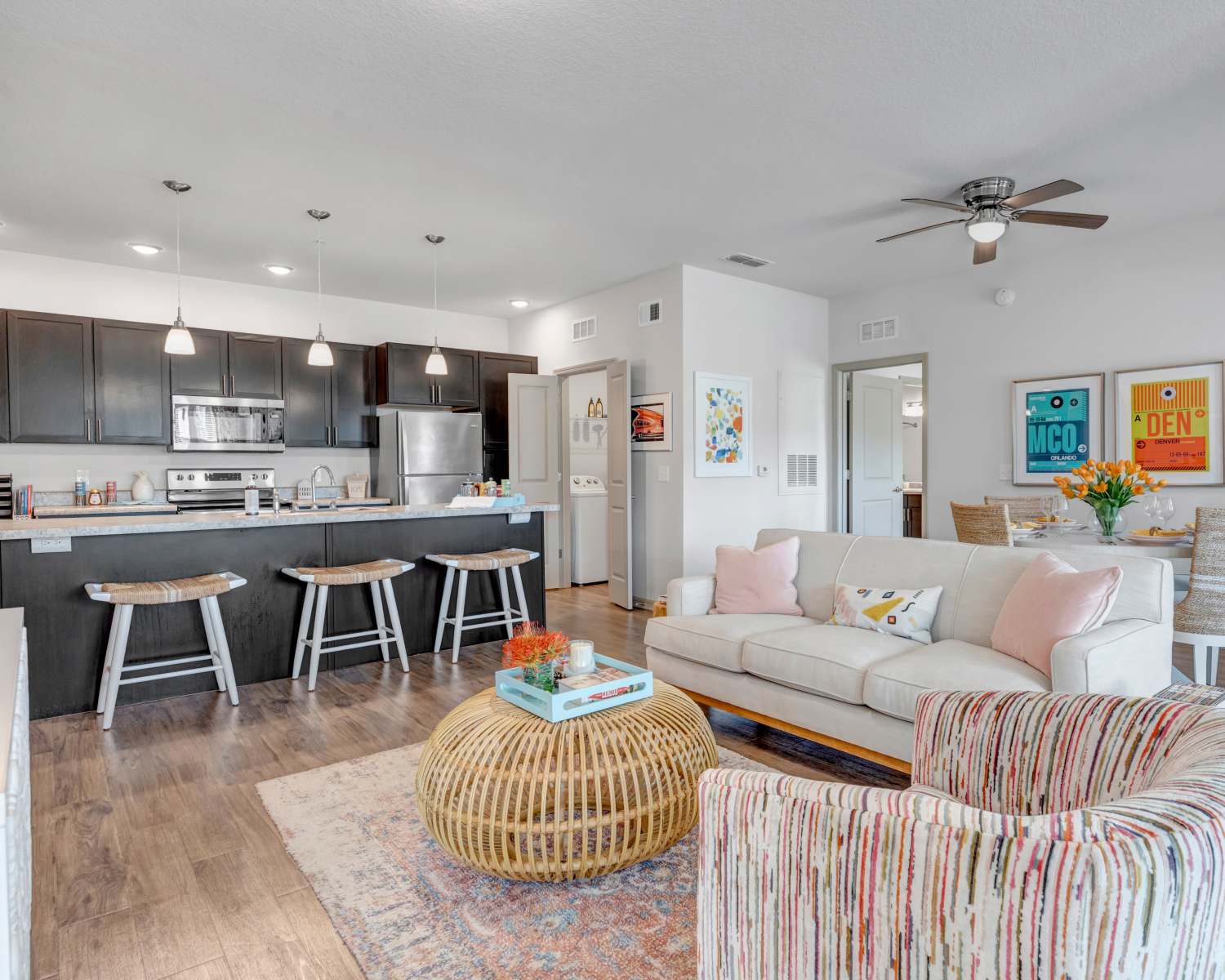 Open layout living room and kitchen at The Carlton of West Melbourne in West Melbourne, Florida 