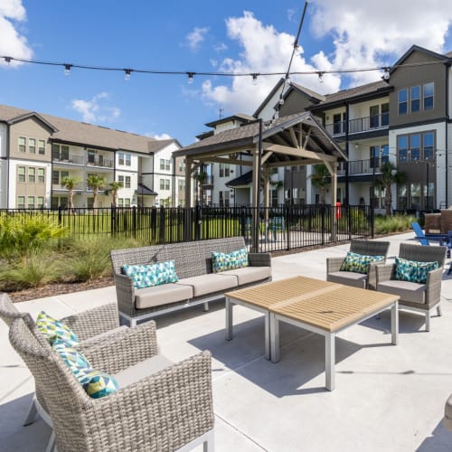 Outdoor seating at Indigo Champions Ridge in Davenport, Florida