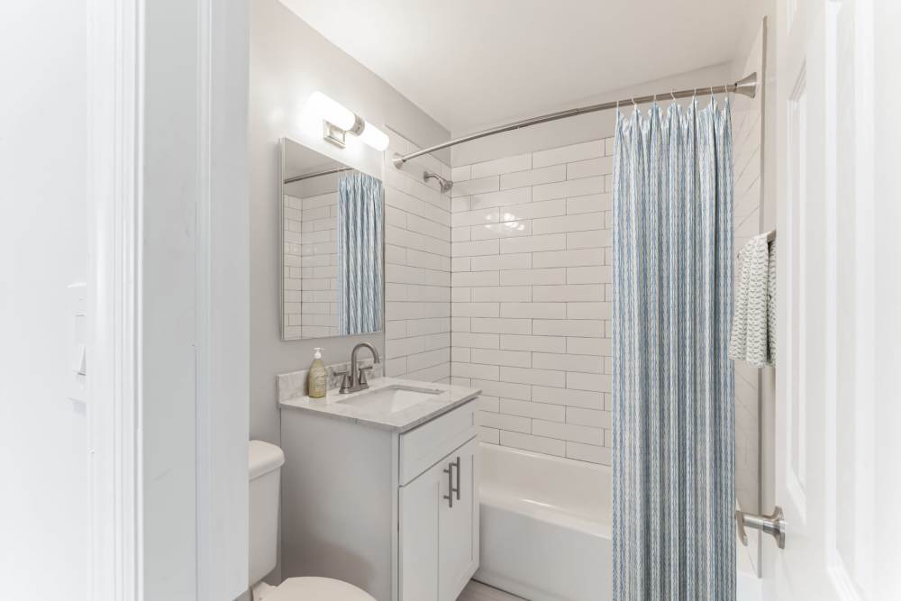 White beautiful bathroom at Mid Island Apartments Bay Shore, New York