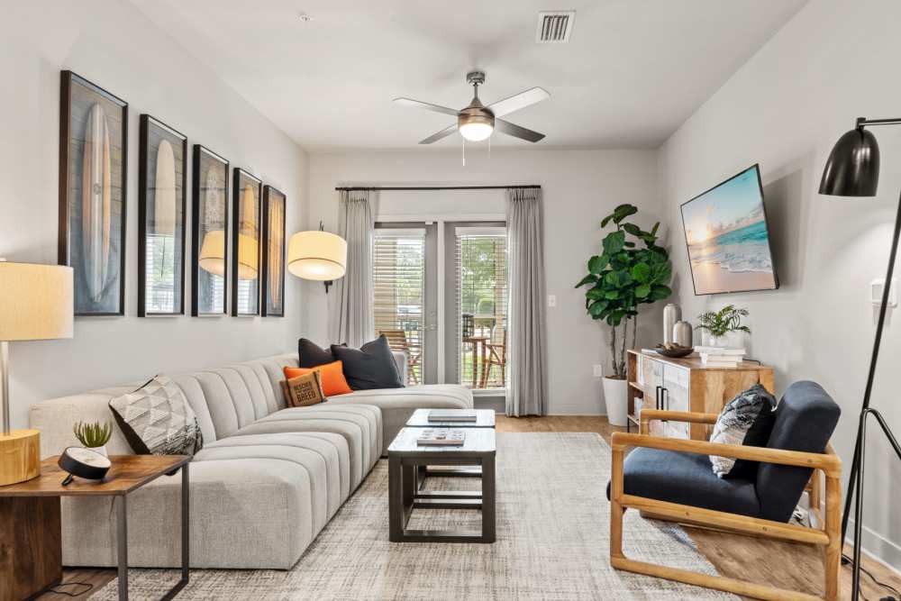 Modern furnishings with hardwood flooring in a model apartment at Pier Park Crossings in Panama City Beach, Florida