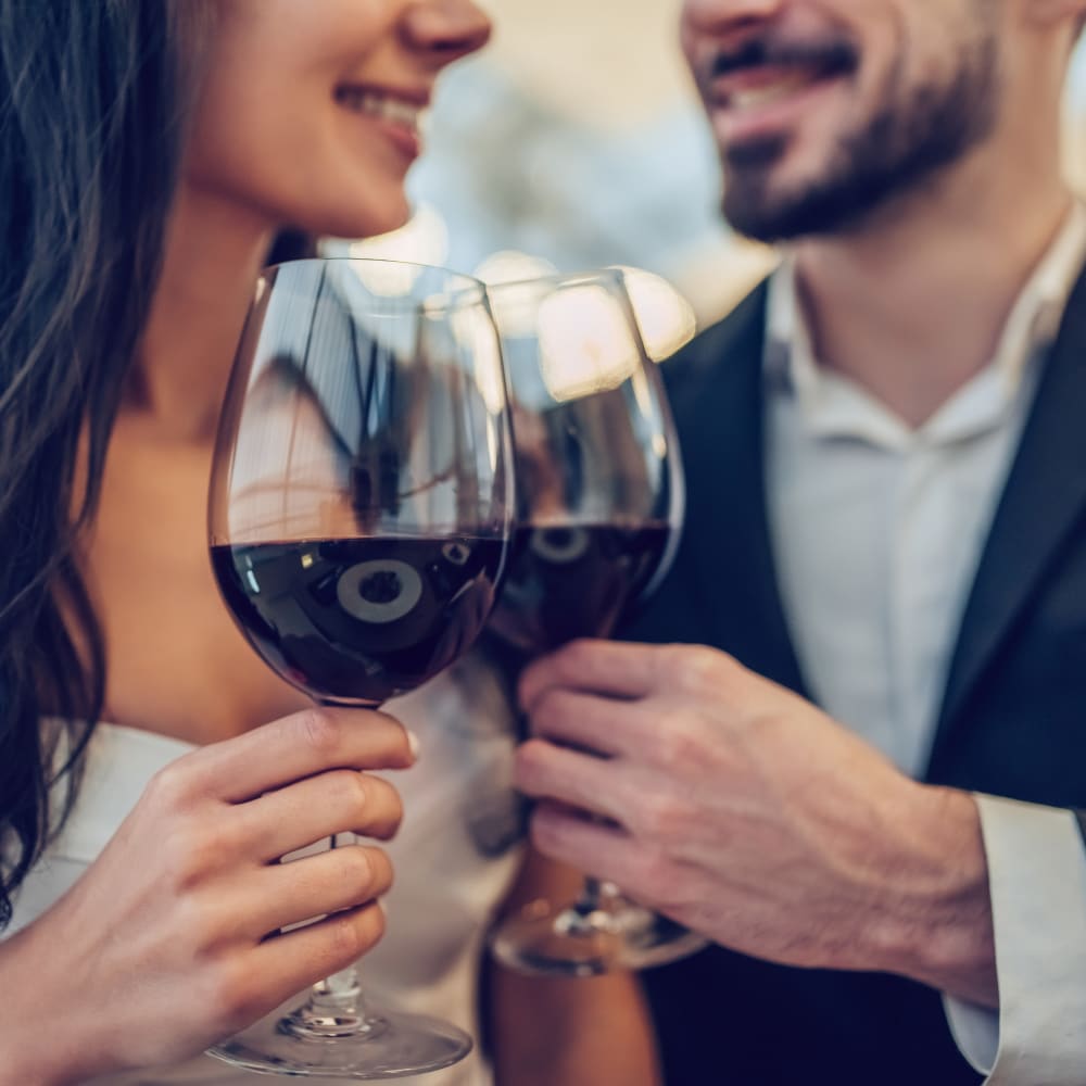 Couple raising a glass of wine to celebrate their decision to move to Terra Camarillo in Camarillo, California