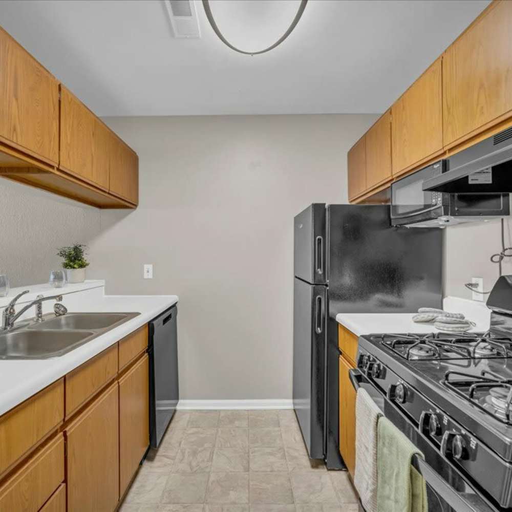 Kitchen with wooden cabinets at Wyndham Hill in Grand Rapids, Michigan
