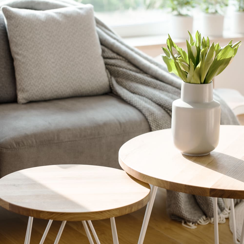Cozy sofa with round wooden coffee table at Townhomes on Gading in Hayward, California