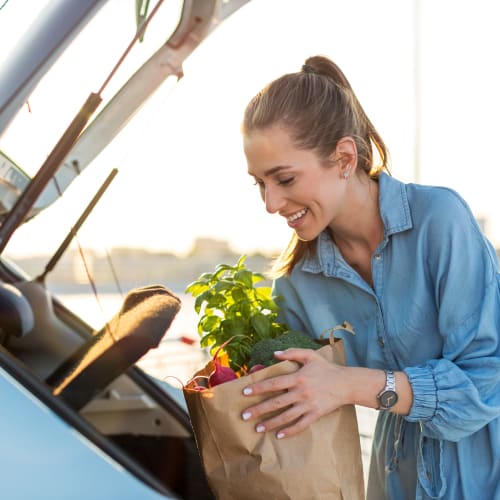 A resident loading groceries into a car near Pecan Crescent in Chesapeake, Virginia