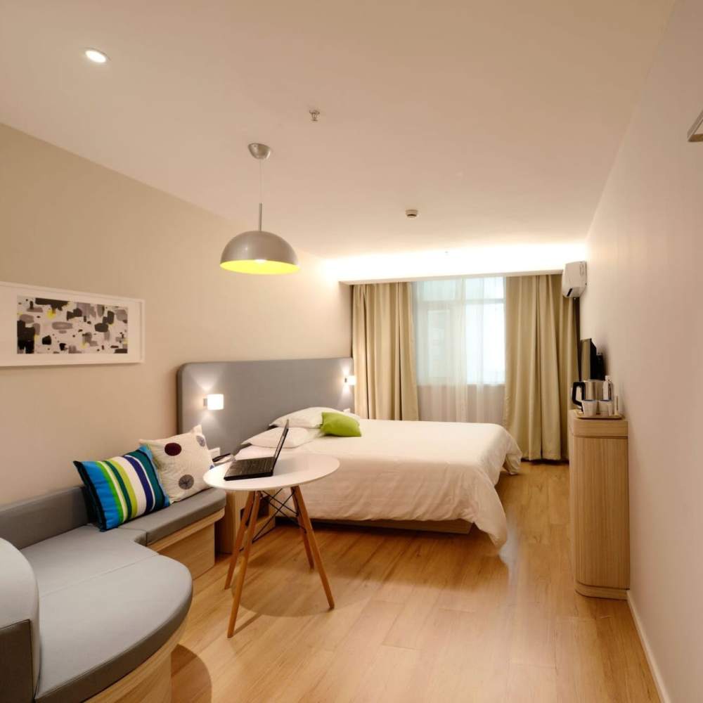 Bedroom with ambient lighting at Fairfax Towers in West Hollywood, California