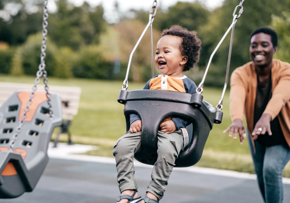 Baby in a swing at The Jones in Hillsboro, Oregon