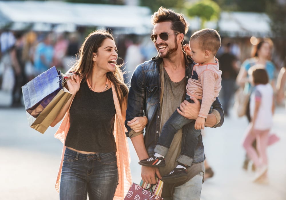 Family shopping and enjoying the entertainment near 1801 MetroWest in Orlando, Florida