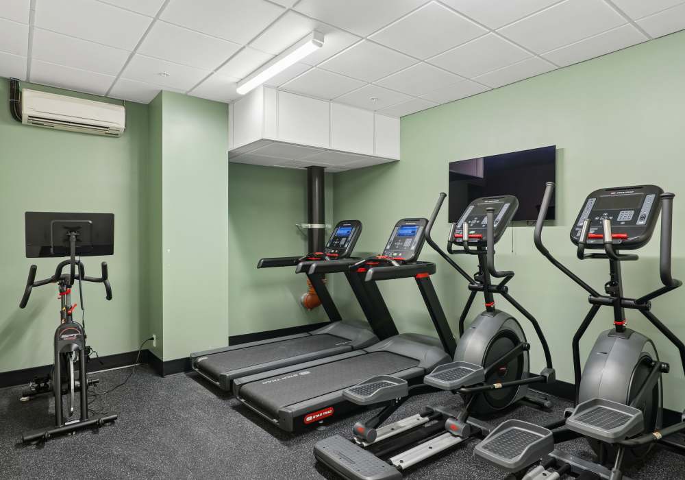 Fitness center with cardiac strength machine at Mily on Green in Philadelphia, Pennsylvania