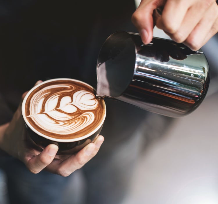 Barista making a latté for a customer near Haven New Providence in New Providence, New Jersey
