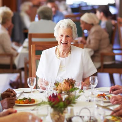 A woman enjoying the dining at Westminster Memory Care in Lexington, South Carolina