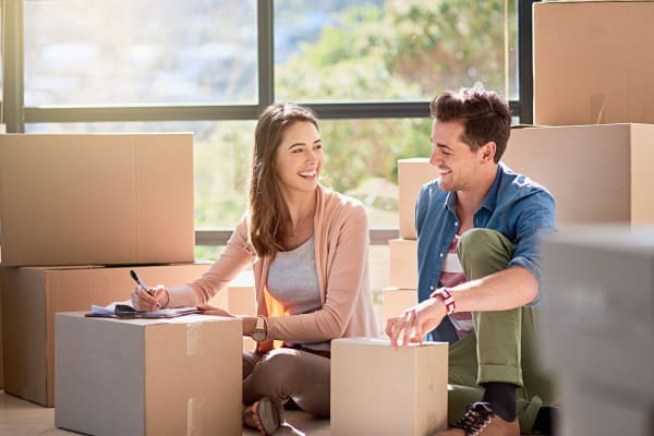 Couple packing boxes at ABC Mini Storage in Washington