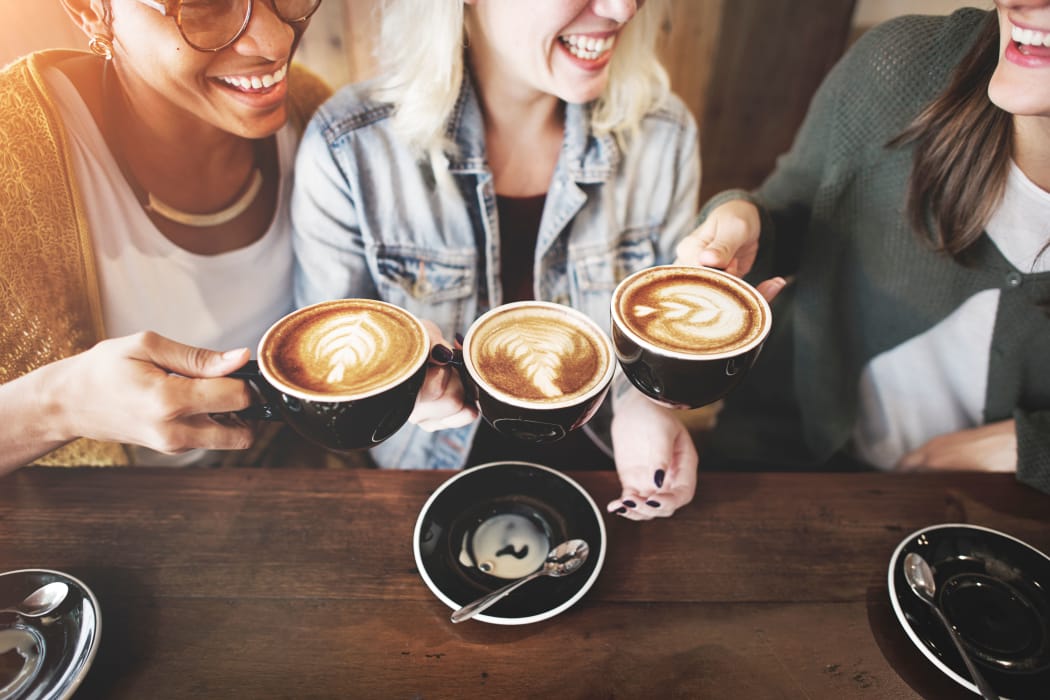 Friends enjoying coffee at Crown Pointe Apartments in Oklahoma City, Oklahoma