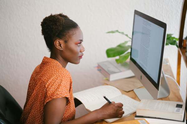 A woman working in her desktop at Kimpton in Houston,Texas
