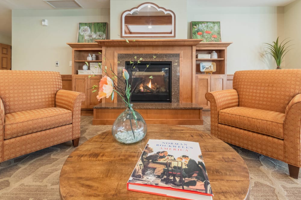 Lounge with fireplace at Applewood Pointe of Roseville at Langton Lake in Roseville, Minnesota. 