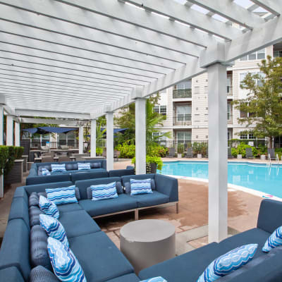 Massive lounge areas right next to the pool where you can relax and enjoy the sun at Sofi Lyndhurst in Lyndhurst, New Jersey