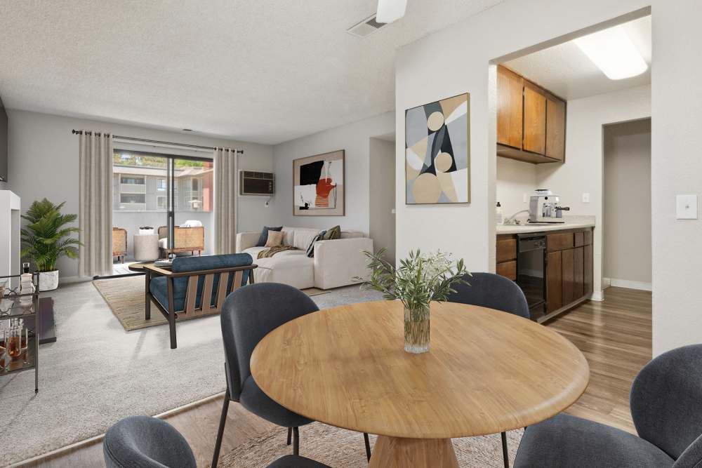 Dining area, kitchen, and living room at Muirwood Apartment Homes in Martinez, California