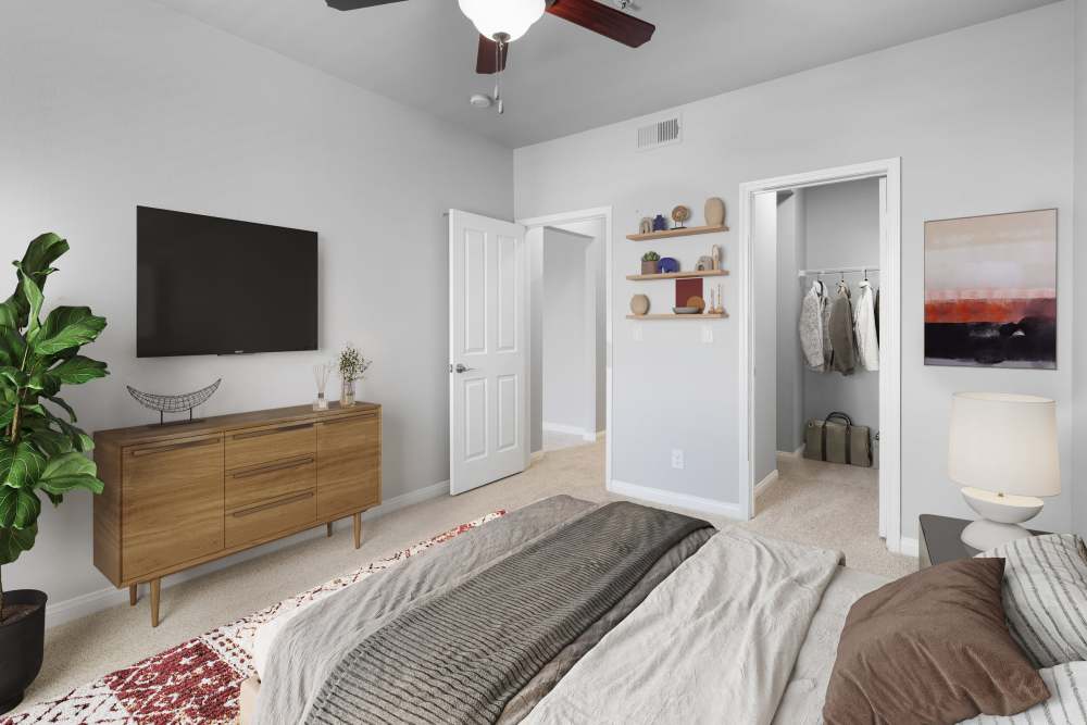 Bedroom with walk-in closet at Alize at Aliso Viejo Apartment Homes in Aliso Viejo, California