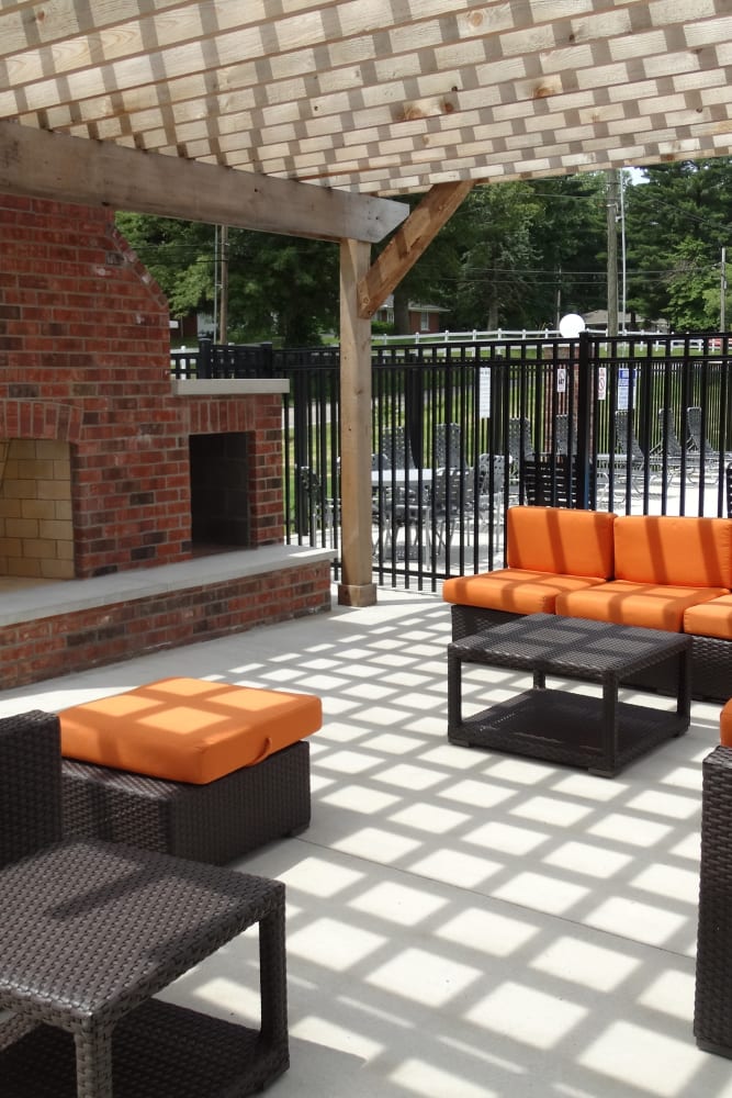 Firepit and poolside seating at Oak Grove Crossing Apartments in Newburgh, Indiana