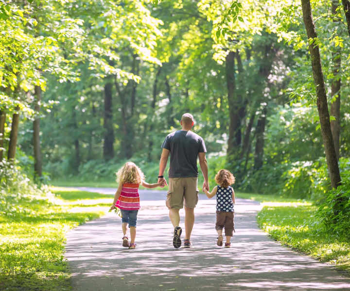 Resident along with his children walking near The Rosewood Apartments in Vancouver, Washington