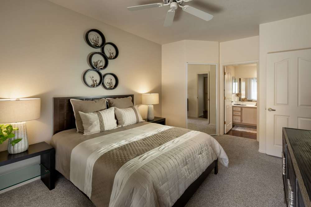 Large master bedroom with walk-in closet in model home at San Palmilla in Tempe, Arizona