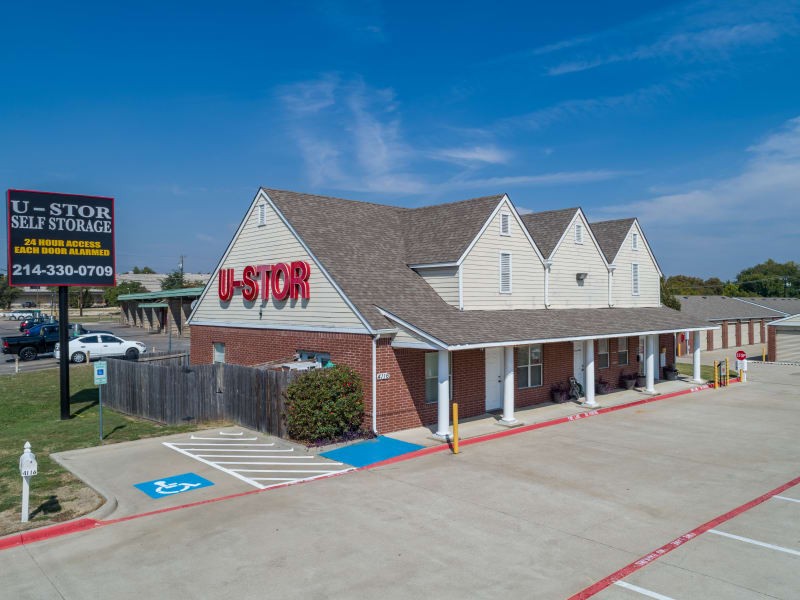 A view of the leasing office and sign at U-Stor Walton Walker in Dallas, Texas