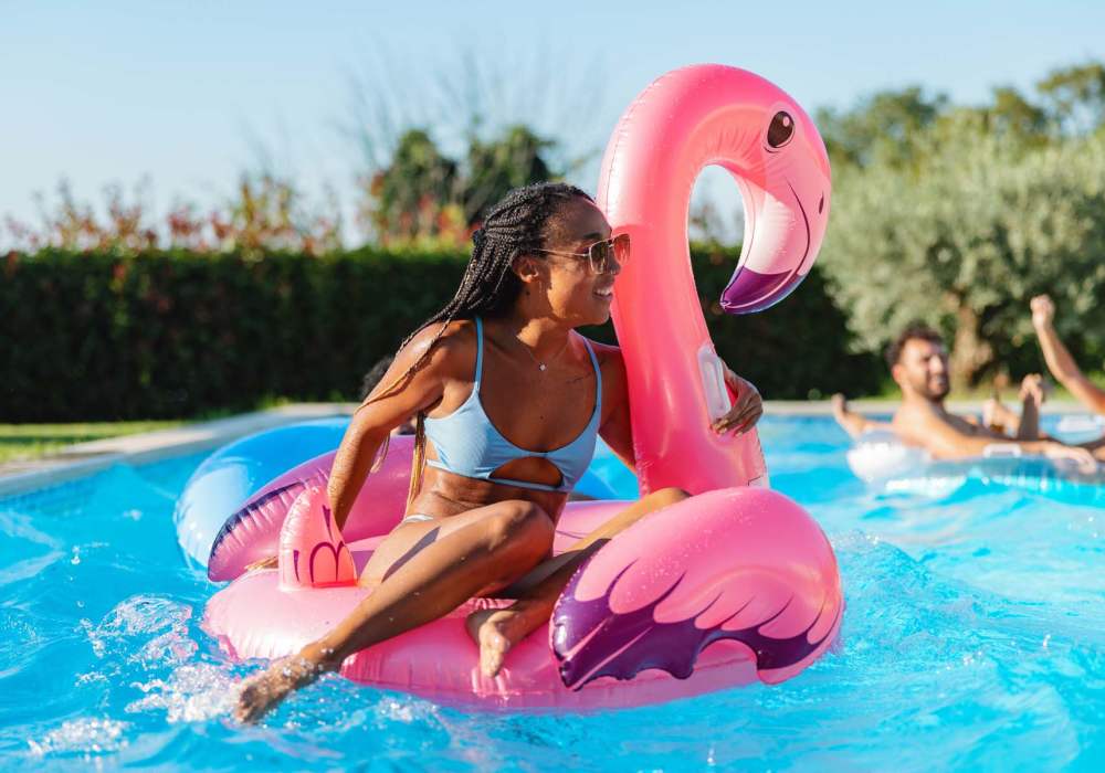 resident having fun in the swimming pool at Athena Garden Apartments in Athens, Texas 