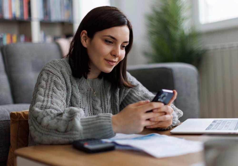 Resident using online portal at Broadway Crossing Apartments in Merrillville, Indiana