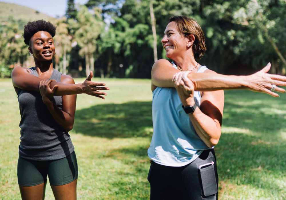 Residents exercising together in a park near North Road Townhomes in Scottsville, New York