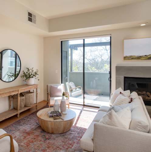 Living room with fireplace at 1801L Apartments in Sacramento, California