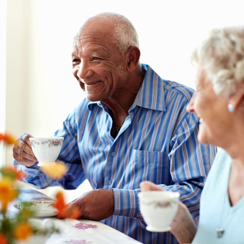 Residents enjoying coffee together at The Hearth at Greenpoint in Liverpool, New York