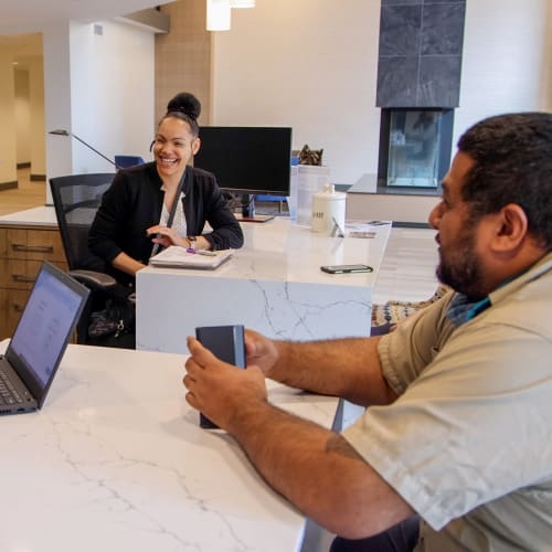 Employees collaborating in an office at Pillar Properties in Seattle, Washington
