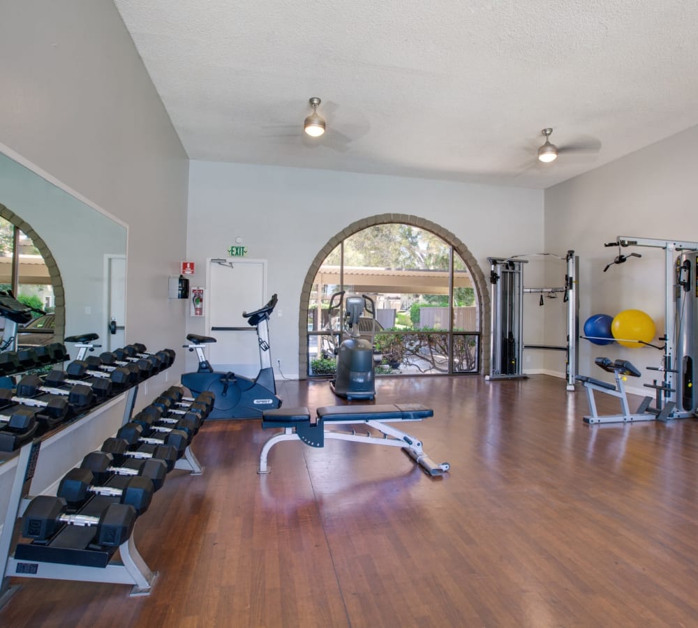 Resident fitness center with free weight to get a good workout on at Terra Camarillo in Camarillo, California