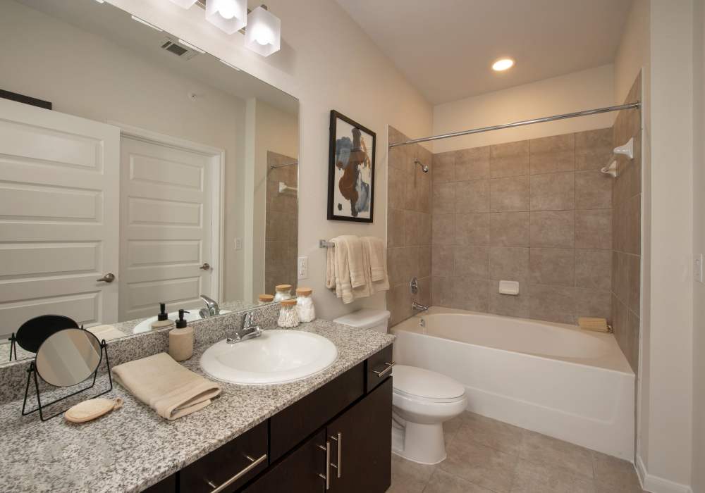 Bathroom with sink and commode at Nantucket at Fannin Station in Houston, Texas
