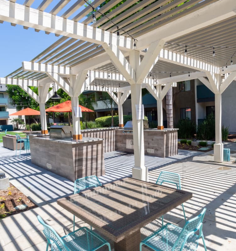 Large community barbecue area with gas grills at Haven Warner Center in Canoga Park, California