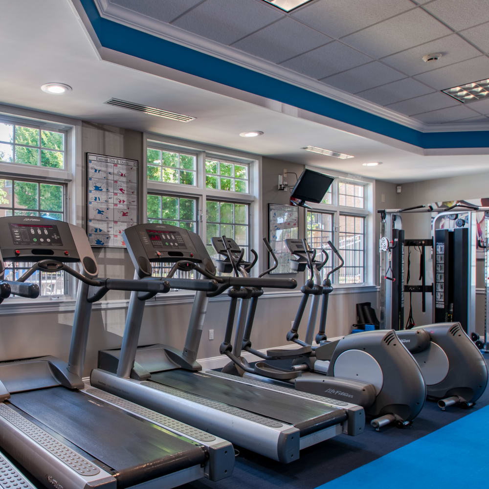 Well-equipped fitness center at Hill Brook Place Apartments in Bensalem, Pennsylvania