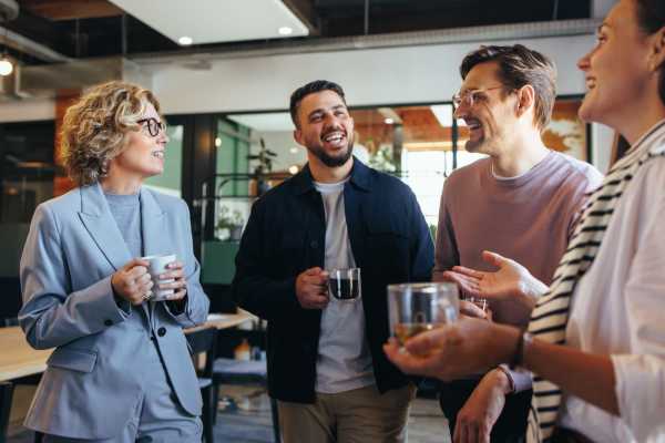 Coworkers drinking coffee near Delta View Apartments in Antioch, California