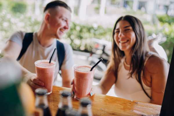 Residents having drinks a restaurant at Briar Forest Lofts in Houston, Texas