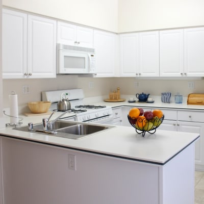 White cabinets in a kitchen at The Village at NTC in San Diego, California