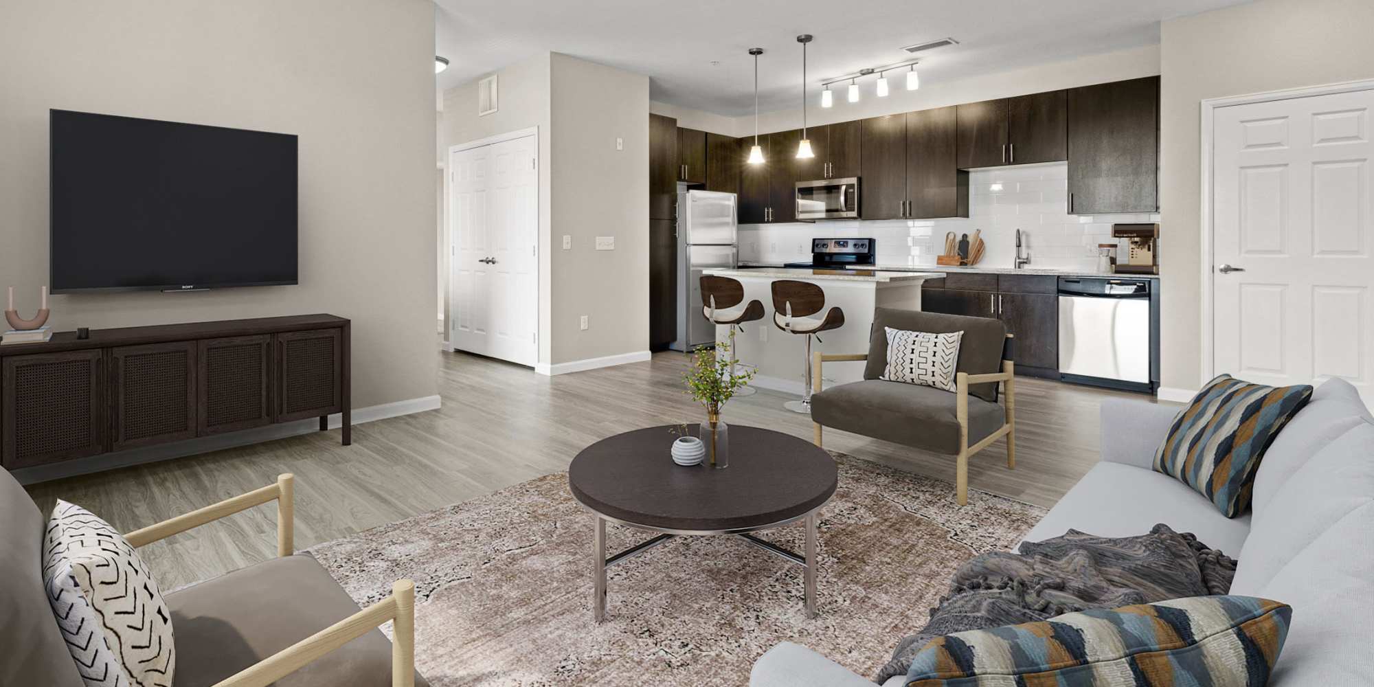 Living room and kitchen at The Parc at Greenwood Village in Greenwood Village, Colorado