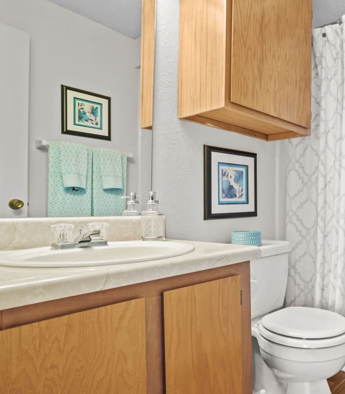 Bathroom with clean Tile flooring at Silver Springs Apartments in Wichita, Kansas