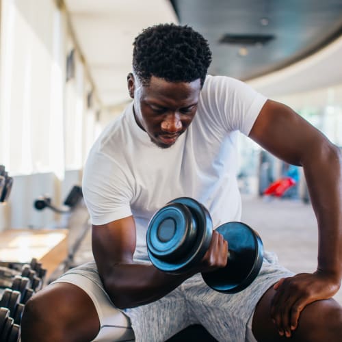 Resident lifting weights at Solaire 8250 Georgia in Silver Spring, Maryland