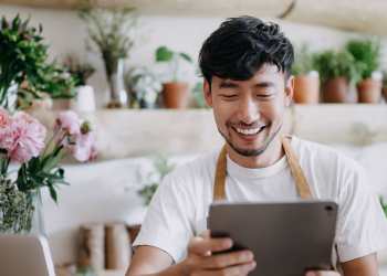 Man holding at tablet in a shop near Ashford Park in Sacramento, California