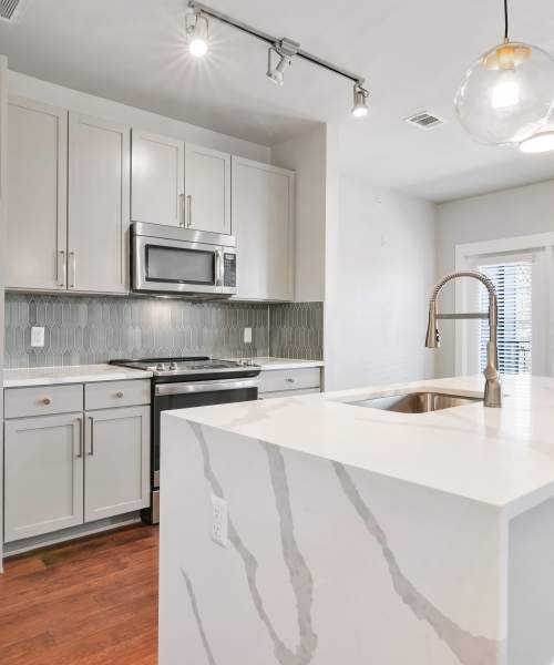 Kitchen with wooden flooring at The Standard in Dallas, Texas
