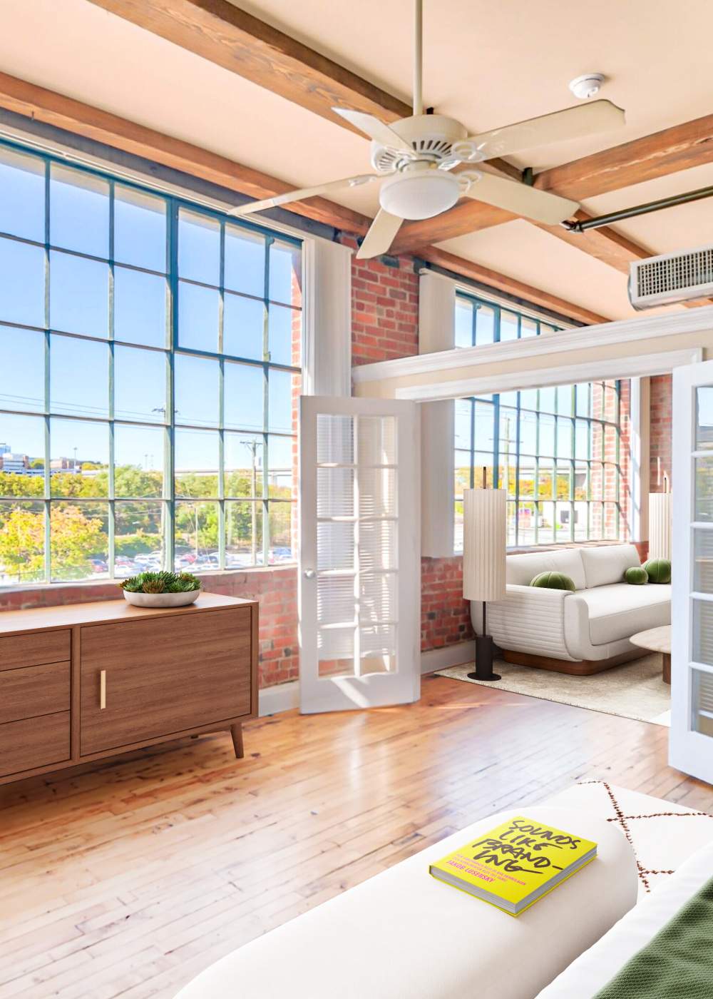 Apartment living room with large windows at Cigar Lofts in Richmond, Virginia