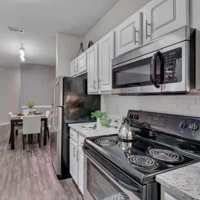 Kitchen with wooden cabinets at Weston Reserve Apartments, Morrisville, North Carolina