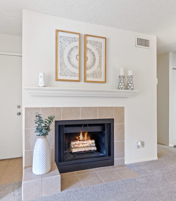 Living room with fireplace at Sugarberry Apartments in Tulsa, Oklahoma