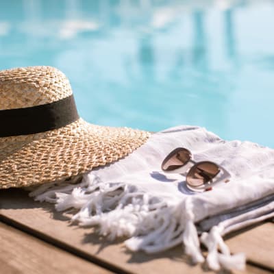 a hat and sunglasses by the pool at Marine Palms in Twentynine Palms, California